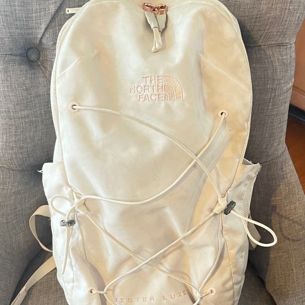 White and rose gold north face jester backpack